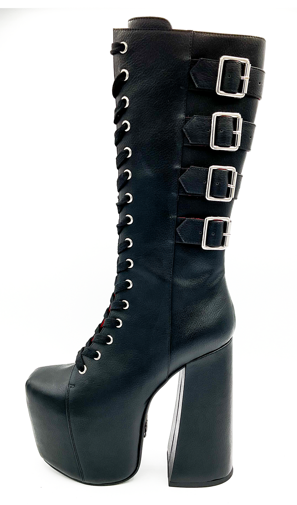 Black platform boot with buckles on a white background