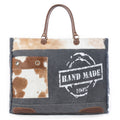 Myra Dakota Trail Hairon Leather Weekender Bag â€“ Handmade Canvas Print with Rustic Fringe Sides & Leather Handles